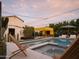 Inviting backyard pool and spa with a modern pergola and comfortable lounge chairs at 61 W Wilshire Dr, Phoenix, AZ 85003