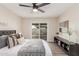 Spacious bedroom with a king-size bed, sliding door to patio, and built-in shelving at 619 E Jensen St # 55, Mesa, AZ 85203