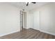 Bedroom with wood-look floors and double door closet at 619 E Jensen St # 55, Mesa, AZ 85203