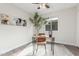 Home office with wood desk and chair, decorative plant and art at 619 E Jensen St # 55, Mesa, AZ 85203