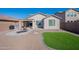 Large backyard with patio, artificial grass and grill at 7067 W Maya Way, Peoria, AZ 85383