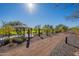 Gravel path with desert landscaping and a gazebo at 7067 W Maya Way, Peoria, AZ 85383