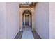 Inviting entryway with an arched doorway and tile flooring at 7067 W Maya Way, Peoria, AZ 85383