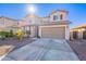 Two-story house with a two-car garage and desert landscaping at 7067 W Maya Way, Peoria, AZ 85383