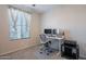 Spacious home office with a large window and comfortable workspace at 7067 W Maya Way, Peoria, AZ 85383