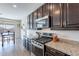 Modern kitchen with stainless steel appliances and granite countertops at 7067 W Maya Way, Peoria, AZ 85383