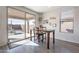 Bright kitchen nook with sliding glass door leading to backyard patio at 7067 W Maya Way, Peoria, AZ 85383