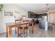 Kitchen nook with wood table and chairs, offering casual dining space at 7067 W Maya Way, Peoria, AZ 85383