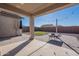 Covered patio with seating area and string lights at 7067 W Maya Way, Peoria, AZ 85383