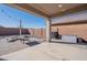 Covered patio with seating area and grill at 7067 W Maya Way, Peoria, AZ 85383