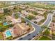 Aerial view of a community with houses, pools, and a golf course at 7710 E Monica Dr, Scottsdale, AZ 85255