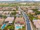 Aerial view showing a house with a pool and surrounding neighborhood at 7710 E Monica Dr, Scottsdale, AZ 85255