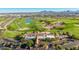 Aerial view of a golf course clubhouse and surrounding area at 7710 E Monica Dr, Scottsdale, AZ 85255