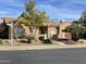 One-story house with stucco exterior, tile roof, and landscaped yard at 7710 E Monica Dr, Scottsdale, AZ 85255