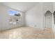 Bright living room with tile floors and large window offering natural light at 7710 E Monica Dr, Scottsdale, AZ 85255