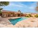 Luxury backyard retreat showcasing a large pool and expansive patio area at 7710 E Monica Dr, Scottsdale, AZ 85255