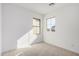 Bright bedroom with carpeted floor and window at 9242 E Sector Dr, Mesa, AZ 85212