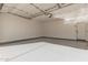 Attached garage with epoxy floor and door at 9242 E Sector Dr, Mesa, AZ 85212