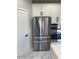 Stainless steel refrigerator and oven combo sit beside white cabinets in this bright kitchen at 1224 W Howe St, Tempe, AZ 85281