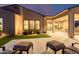 Landscaped backyard with patio and seating area at dusk at 13271 E Desert Vista Rd, Scottsdale, AZ 85255