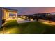 Evening view of backyard, patio furniture, and landscaping at 13271 E Desert Vista Rd, Scottsdale, AZ 85255