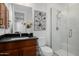 Clean bathroom with a walk-in shower and dark vanity at 13271 E Desert Vista Rd, Scottsdale, AZ 85255