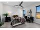 Bright bedroom with a queen-size bed and two accent chairs at 13271 E Desert Vista Rd, Scottsdale, AZ 85255