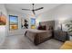 Spacious bedroom with a king-size bed, large windows, and ceiling fan at 13271 E Desert Vista Rd, Scottsdale, AZ 85255