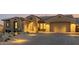 Single-story home with a two-car garage and well-manicured desert landscaping at 13271 E Desert Vista Rd, Scottsdale, AZ 85255