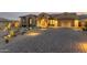Beautiful desert landscape with single-story home, two-car garage, and lighted driveway at 13271 E Desert Vista Rd, Scottsdale, AZ 85255