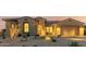 Single-story home with a two-car garage and nicely lit desert front yard at 13271 E Desert Vista Rd, Scottsdale, AZ 85255