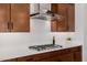 Modern kitchen features gas cooktop, stainless steel range hood, and white quartz countertops at 13271 E Desert Vista Rd, Scottsdale, AZ 85255