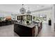 Open kitchen features a large island and breakfast bar, looking into the living room at 13271 E Desert Vista Rd, Scottsdale, AZ 85255