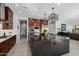 Modern kitchen with a large island, stainless steel appliances, and ample counter space at 13271 E Desert Vista Rd, Scottsdale, AZ 85255