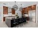 Spacious kitchen with island, stainless steel appliances, and dark wood cabinets at 13271 E Desert Vista Rd, Scottsdale, AZ 85255