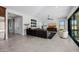 Bright living room featuring a large TV, comfortable seating and tile floors at 13271 E Desert Vista Rd, Scottsdale, AZ 85255
