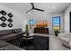 Relaxing living room with a large TV and comfortable seating area at 13271 E Desert Vista Rd, Scottsdale, AZ 85255
