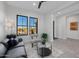 Cozy living room with comfortable seating, a coffee table, and large windows at 13271 E Desert Vista Rd, Scottsdale, AZ 85255