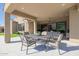 Covered patio features dining area with seating for six and an outdoor kitchen at 13271 E Desert Vista Rd, Scottsdale, AZ 85255