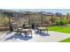 Relaxing patio with two lounge chairs, ottomans, and a side table at 13271 E Desert Vista Rd, Scottsdale, AZ 85255