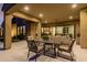 Covered patio with seating area and view of the kitchen at 13271 E Desert Vista Rd, Scottsdale, AZ 85255