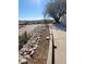 Landscaped area with rocks and a tree next to the driveway at 15326 E Mustang Dr, Fountain Hills, AZ 85268