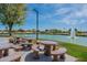 Enjoy scenic views and relaxing atmosphere by the lake with seating areas at 15797 W Remington Dr, Surprise, AZ 85374