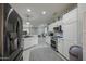 Spacious kitchen featuring stainless steel appliances and white cabinetry at 15797 W Remington Dr, Surprise, AZ 85374