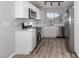 Modern kitchen with white shaker cabinets and stainless steel appliances at 1620 W Burgess Ln, Phoenix, AZ 85041