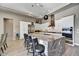 Modern kitchen with large island and white cabinetry at 29606 N Tarragona Dr, Peoria, AZ 85383