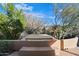 Relaxing hot tub with tiled surround and steps at 6930 E Stevens Rd, Cave Creek, AZ 85331