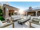 Relaxing backyard patio with seating area and fireplace, perfect for outdoor entertaining at 9053 N 46Th St, Phoenix, AZ 85028
