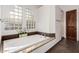 Relaxing bathroom with soaking tub and glass block window at 9053 N 46Th St, Phoenix, AZ 85028