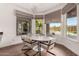 Bright breakfast nook with a marble table and views of the pool at 9053 N 46Th St, Phoenix, AZ 85028